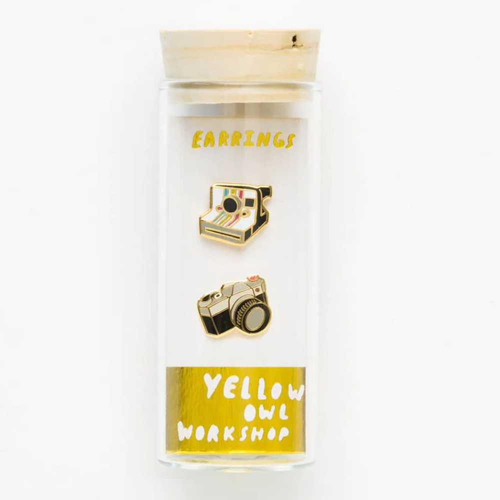 Camera earrings in an elegant glass vial package.