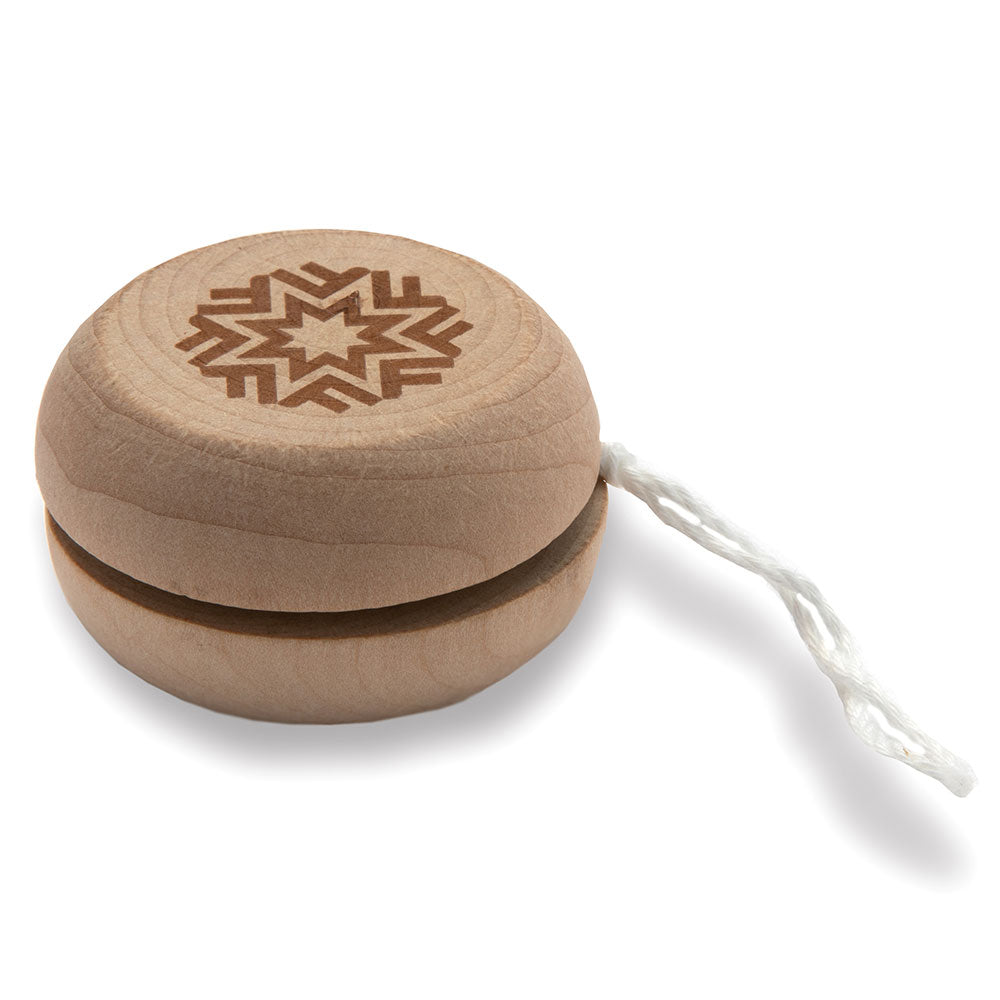 Well-crafted wooden yoyo with white string and the Fotografiska logo chipped into the wood.