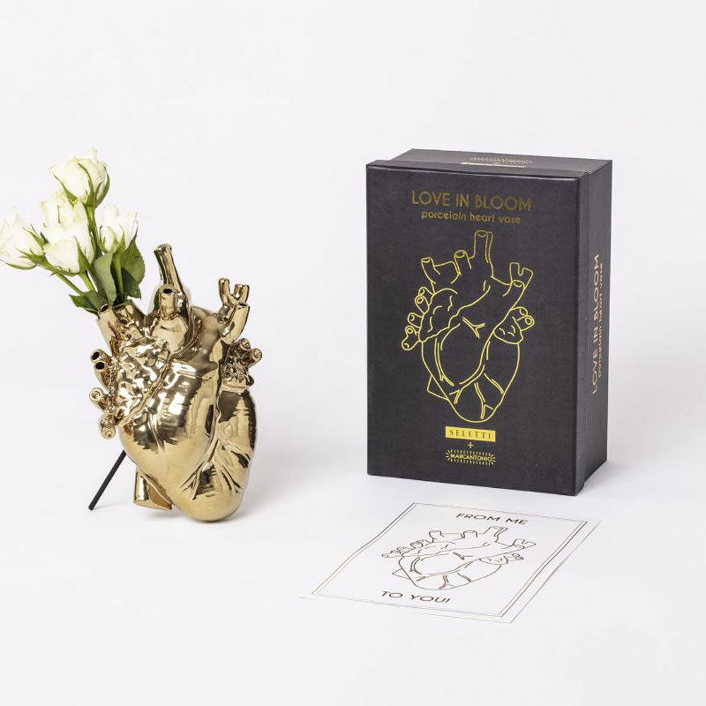 Seletti heart vase in gold with flowers and black packaging